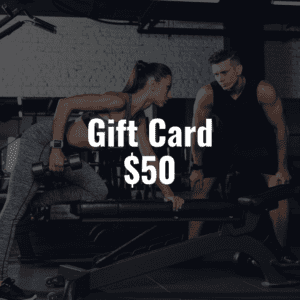 Two individuals in a fitness facility happily presenting a valuable Gift Card $50.